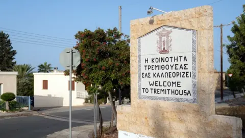 PA Media A stone sign welcoming people to Tremithousa