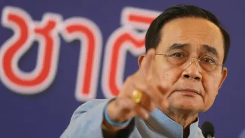 EPA Thai Prime Minister Prayut Chan-o-cha gestures during a press conference after a weekly cabinet meeting at the Government House in Bangkok, Thailand, 18 August 2020