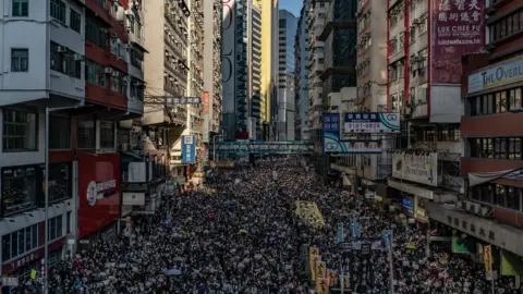Getty Images Protesters fill a street in Hong Kong