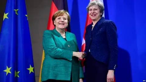 AFP Angela Merkel and Theresa May
