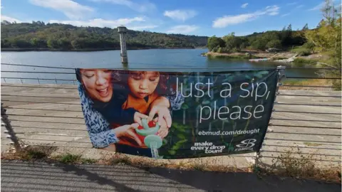 Getty Images A sign in California asks people to conserve water