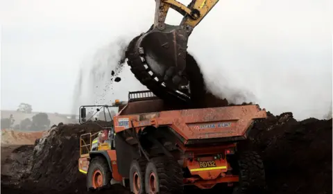 Getty Images Truck being loaded with coal in Australia