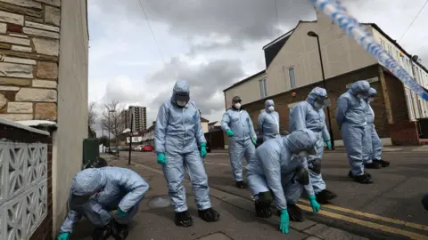 Jonathan Brady Forensic officers at the scene