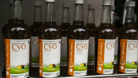 AFP Bottles of Covid-Organics