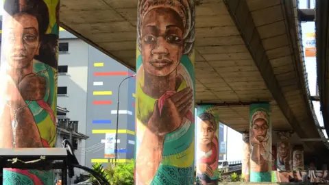 Getty Images Girls' faces painted on a bridge on Saturday 5 October 2019