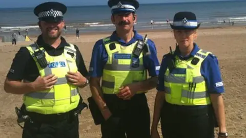 BBC Police officers on Mablethorpe beach