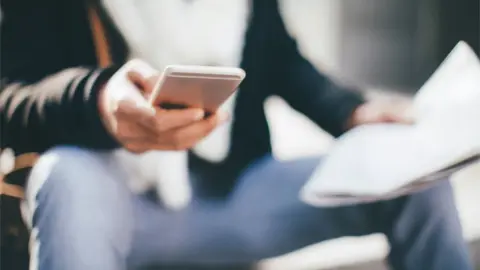 Getty Images Person using phone