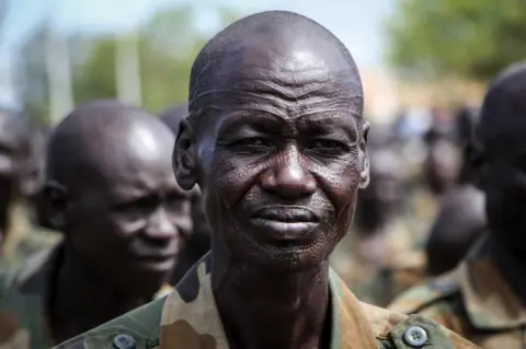 AFP New members of South Sudan People's Defence Forces (SSPDF) of the Unified Forces attend the graduation ceremony in Malakal on November 21, 2022