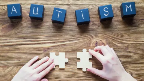 Getty Images Wooden cubes that spell out autism