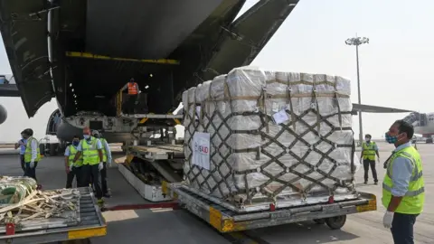 Getty Images US aid is unpacked from an aircraft in Delhi