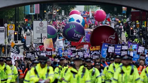 Getty Images Demonstrators from the People’s Assembly take part in a march to protest