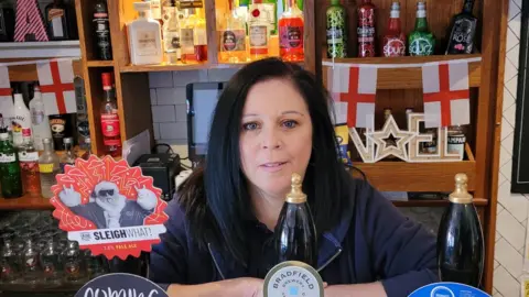 BBC News A pub landlady behind the bar