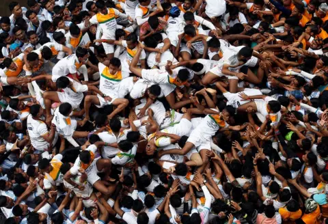 Danish Siddiqui/ Reuters A huge mass of people lie on top of each other