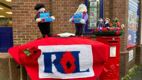 Julie McGowan Knitted poppies post box topper Torquay