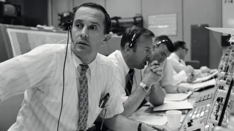 NASA Left to right: Charlie Duke, Jim Lovell and Fred Haise in Mission Control during the Apollo 11 mission