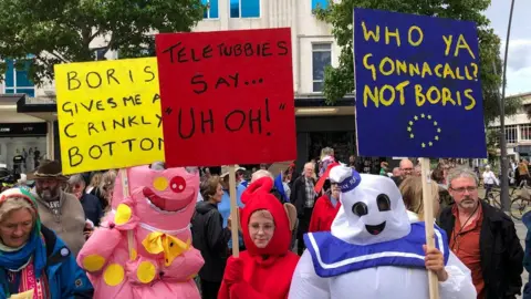 Richard Simpson Protesters dressed as children's characters in Plymouth