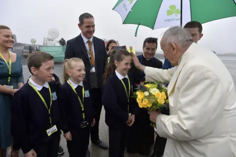 AFP Pope Francis greets children at Knock Airport