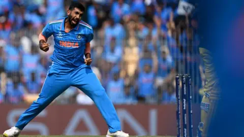 Getty Images India's Jasprit Bumrah celebrates after taking the wicket of Australia's Mitchell Marsh during the 2023 ICC Men's Cricket World Cup one-day international (ODI) match between India and Australia at the MA Chidambaram Stadium in Chennai on October 8, 2023. (Photo by Punit PARANJPE / AFP) / -- IMAGE RESTRICTED TO EDITORIAL USE - STRICTLY NO COMMERCIAL USE -- (Photo by PUNIT PARANJPE/AFP via Getty Images)