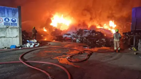 Suffolk Fire and Rescue Service Fire crews using jets to put out fire