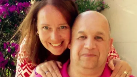 Jenny Jacobs Jenny Jacobs and Tim Jacobs smiling at the camera