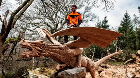PA/Simon O'Rourke Tree Carving Simon O'Rourke carving the fallen tree