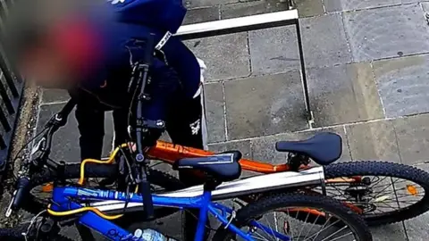 Man caught on CCTV in Peterborough stealing bike