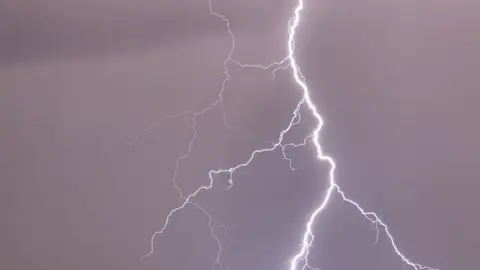 PA Media A lightning bolt during a thunderstorm