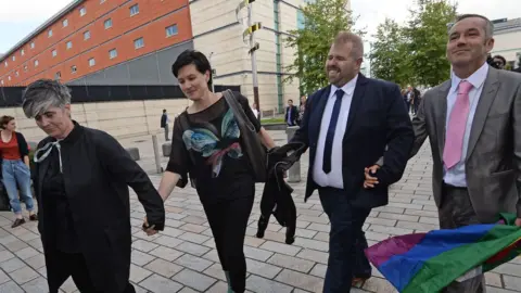 PACEMAKER The two couples leaving court in Belfast