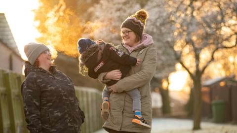 Adopters Kirstie and Amy with their son