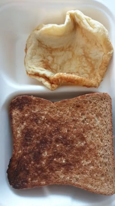 Etienne Pansegrauw/PA Wire Slice of toast and some egg