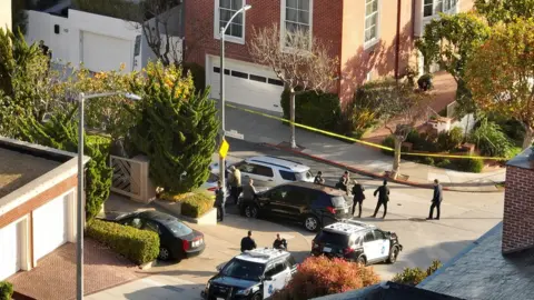 Getty Images Image shows police outside the Pelosi residence in San Francisco on Friday