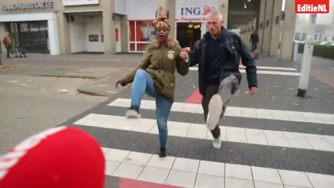 Editie NL Aloys Bijl shows how to use the 'silly walks' crossing in Spijkenisse, Netherlands, 2018