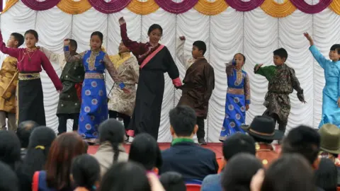 Getty Images Young exiled Tibetans dance during celebrations marking the Lunar New Year or Sonam Lhosar in Kathmandu on February 16, 2018