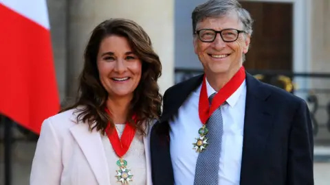 Getty Images Bill and Melinda Gates pose in front of the Élysée Palace after receiving the award of Commander of the Legion of Honor by French President Francois Hollande, 21 April 2017