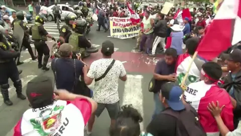 Reuters Crowds of protesters confront a number of police officers in Peru's capital, Lima