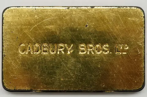 PA Media Back of the tin with Cadbury Bros Ltd engraved into it