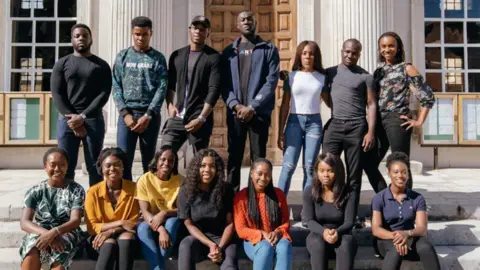 Mabdulle Stormzy with a group Cambridge students