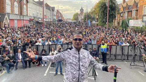 Soho Road Diwali Mela Musician standing in front of crowds
