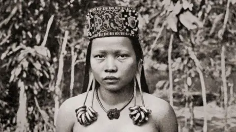 Getty Images A Kenyah woman from Sarawak, Borneo, Malaysia, with distended ear lobes. 