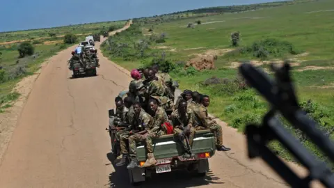 AFP Somali soldiers on a road 450km from Mogadishu, Somalia - Jun 2018