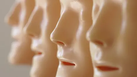 rubber masks with human faces