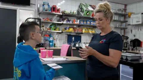 Louise Goodman and a child at the Twyn hub