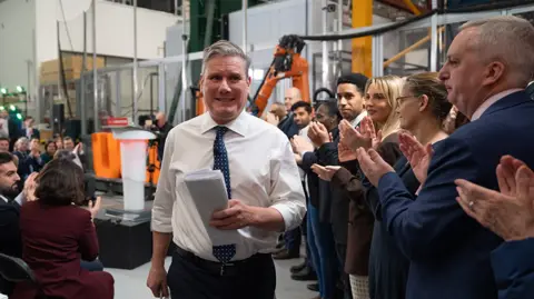Getty Images Labour Party leader Sir Keir Starmer leaves after delivering a New Year's speech at University College London