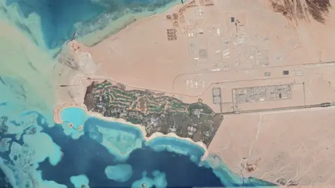 Google earth Satellite image showing part of Neom called a tourist attraction, including a golf course and a helipad