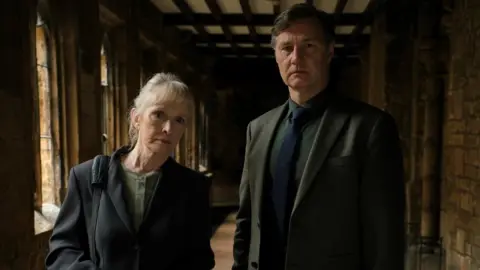 BBC/House Productions/Matt Squire Jennifer Hale (LINDSAY DUNCAN);Ian St.Clair (DAVID MORRISSEY)