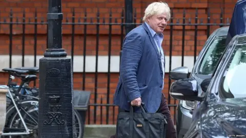 Getty Images Boris Johnson leaving the Foreign Office