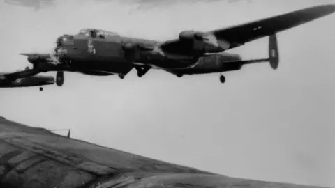 PA Media/NZBCA Archives RAF 617 Squadron aircraft in flight,