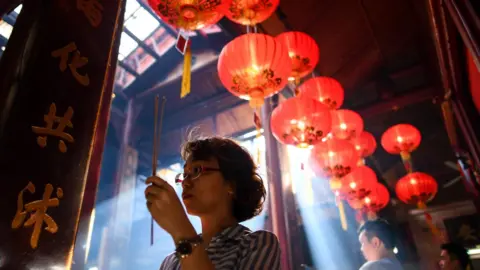 Getty Images Prayers and incense on the first day of the Lunar New Year at Sin Sze Si Ya Temple in Kuala Lumpur, Malaysia, on February 16, 2018,