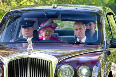 Getty Images Queen and family arriving at Crathie Kirk