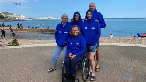 Aspire Paula (centre) and her supporters